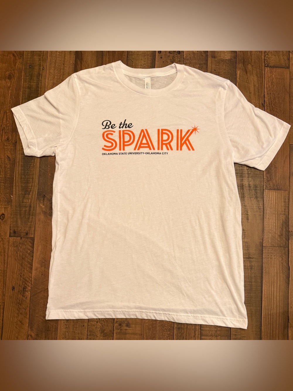 OSU-OKC “Be the Spark” Graphic T-Shirt | Bella + Canvas | Size Large | White